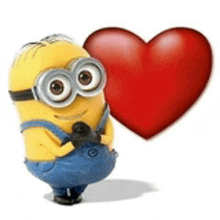 a minion is holding a red heart in his hand .