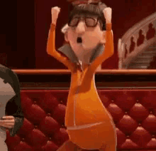 a cartoon character is standing in front of a red couch and raising his arms in the air .