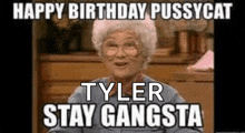 an elderly woman is sitting in front of a table with a happy birthday pussycat tyler stay gangsta meme on it .