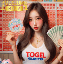 a woman wearing a white shirt that says ' togel ' on the front