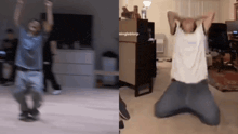 a man in a blue shirt is dancing in a living room and another man is kneeling down in a living room .
