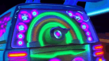 a glow in the dark car with a rainbow of lights on it