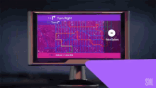 a computer monitor displays a map that says turn right on it