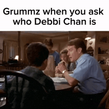 a man sits at a table with two children and says grummz when you ask who debbie chan is