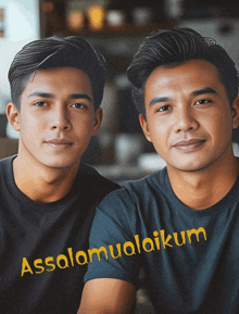 two men are sitting next to each other with the words assalamualaikum written on the front