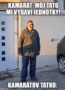 a man with a beard is standing in front of a garage door with a car parked in front of him .