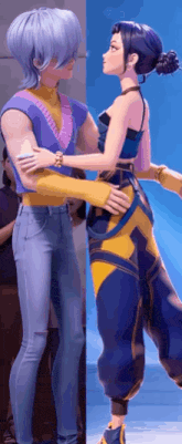 a man and a woman are hugging each other in front of a crowd .