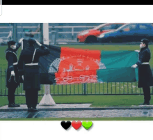 a group of soldiers holding a flag that says afghanistan on it