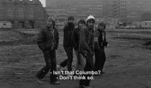 a black and white photo of a group of people with the caption isn 't that columbo