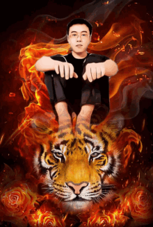 a man sits on a tiger 's back with flames behind him