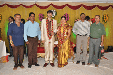 a bride and groom pose for a picture with their friends at a wedding