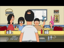 bob 's burgers shows a man standing in front of a counter