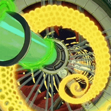 a green pipe is coming out of a wheel with a yellow swirl around it