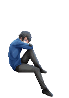 a boy in a blue sweater is sitting on the floor