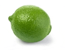 a green lime on a white background .