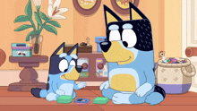 two cartoon dogs are playing a game of cards