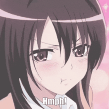 a close up of a girl 's face with the words hmph written below it