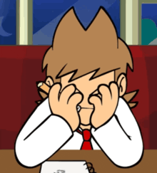a cartoon character is sitting at a table covering his eyes with his hands