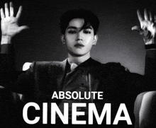 a black and white photo of a man with the words " absolute cinema " below him