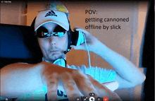 a man wearing a white adidas hat and sunglasses is talking on a video call