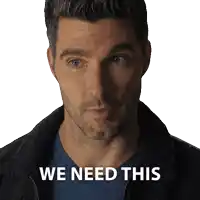 a man with a beard and a jacket says we need this