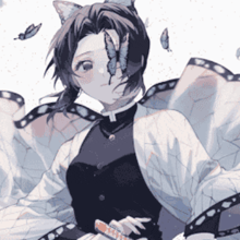 a girl with butterfly wings is holding a sword .