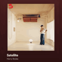 a harry styles album called satellite features a man standing in a room