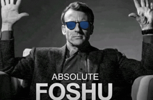 a man wearing sunglasses with the words absolute foshu on the bottom