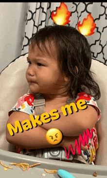 a little girl sits in a high chair with her arms crossed and says " makes me " on the bottom