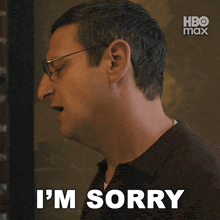 a man with glasses says " i was a jerk " in front of a hbo max logo