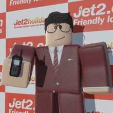 a man in a suit and tie is holding a walkie talkie in front of a jet2 friendly sign