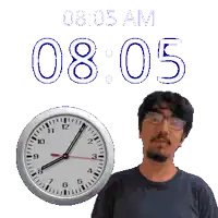 a man stands in front of a clock that says 8:05