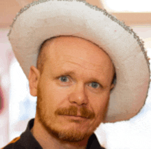 a bald man with a beard wearing a sombrero