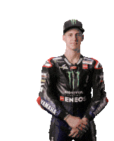 a motorcycle racer wearing a monster eneos jacket and hat