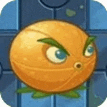 a cartoon orange with a green eye is sitting on top of a blue brick wall .