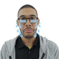 a man with glasses and tears coming out of his face