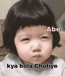 a baby is making a funny face with the words abe kya bola chutiye below it