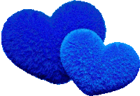 two blue heart shaped pillows are on a white background