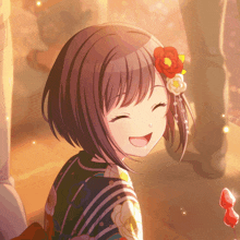 a girl with red flowers in her hair is smiling