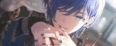 a close up of a person with blue hair and blue nail polish .