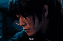 a close up of a person 's face with the words " never " written below it