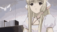 a girl with long blonde hair is standing in front of a bookshelf with a white bird flying in the background .