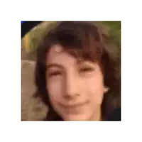 a close up of a person 's face with a blurred background .