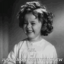 a black and white photo of a little girl laughing and saying lol just makin ' sure you knew .