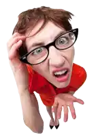 a woman wearing glasses making a funny face with her mouth open