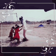 a man and two girls are playing in a muddy field and the words sansk are on the bottom of the photo