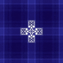 a blue plaid background with a white cross on it .