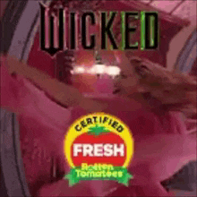 a poster for wicked fresh rotten tomatoes with a woman in a pink dress