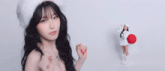 a woman in a white dress and white boots is making a funny face