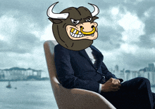 a man in a suit sits in a chair with a bull mask on his head